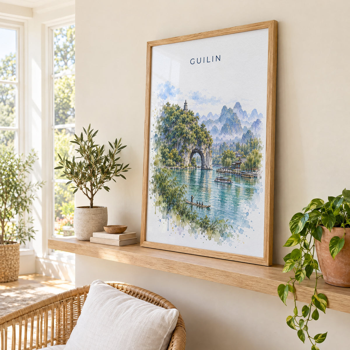 Guilin watercolor print in an oak frame on a picture ledge in a sunlit sunroom