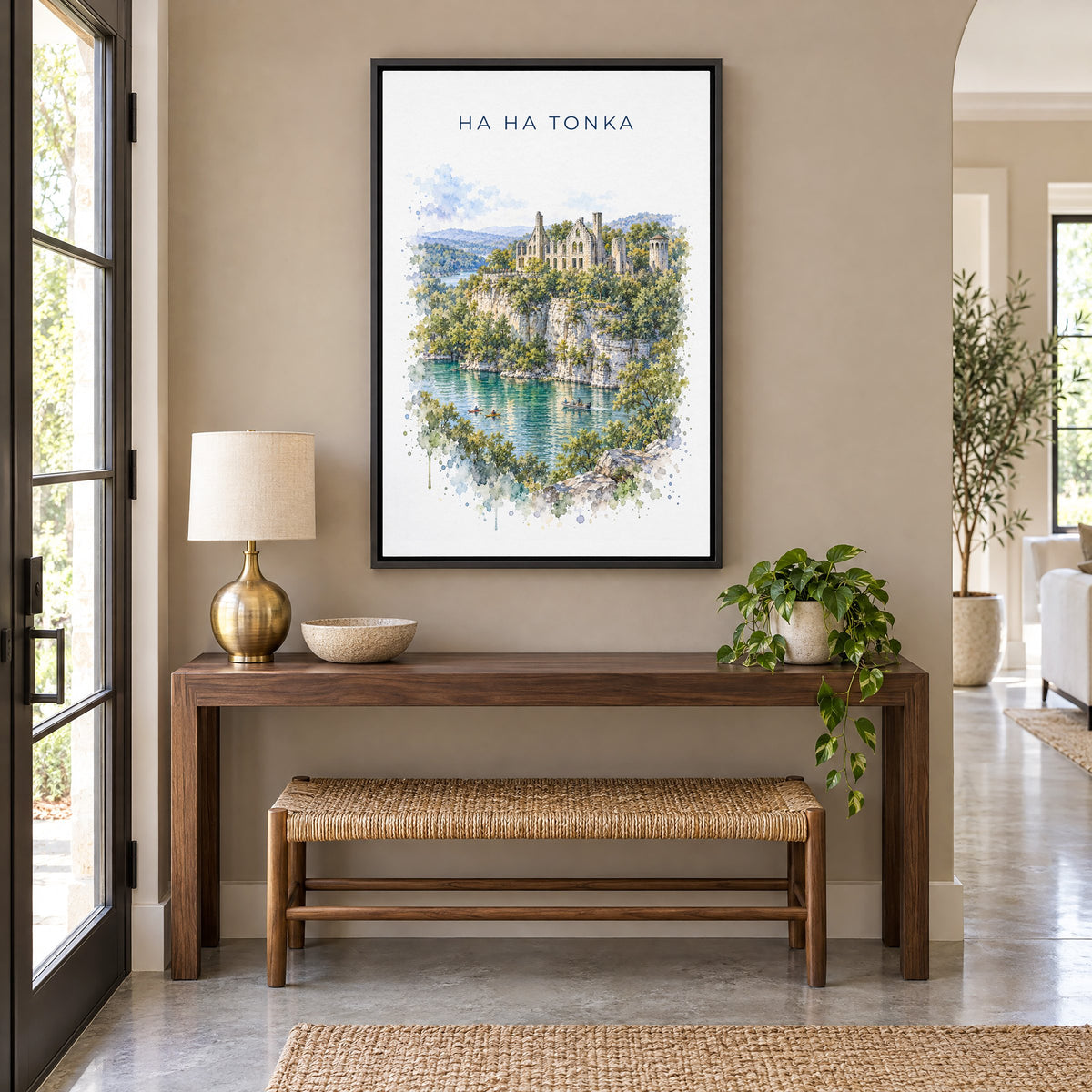 Ha Ha Tonka State Park watercolor print as a black floater canvas above a walnut console and woven bench in an entryway