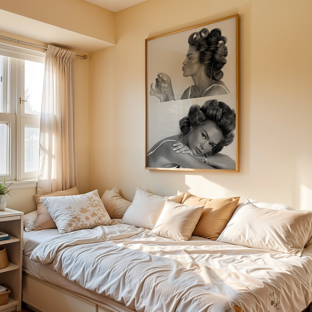 Woman in hair rollers with heart locket two frames print in an oak frame above a cream daybed in a sunny bedroom