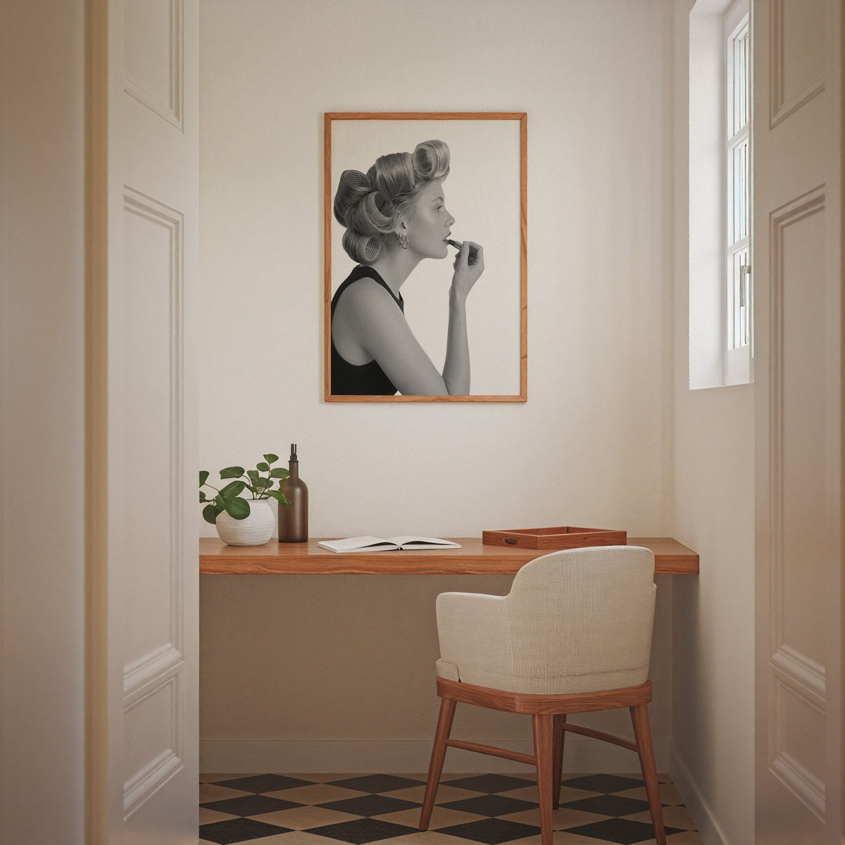 Woman in hair rollers applying lipstick profile print in an oak frame above a home office desk nook
