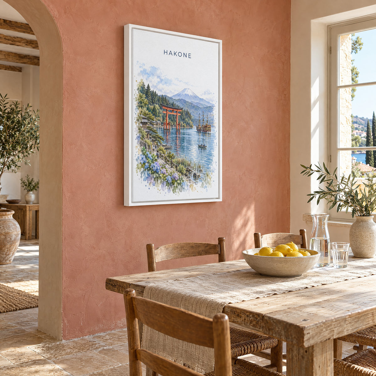 Hakone watercolor print as a white floater canvas on a terracotta wall above a rustic dining table