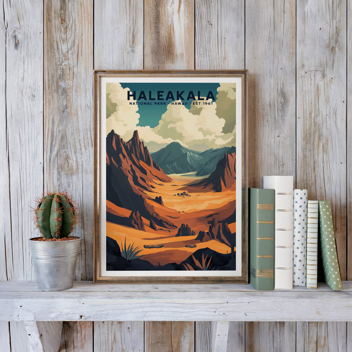 Haleakalā poster in an antique gold frame against whitewashed farmhouse planks and books