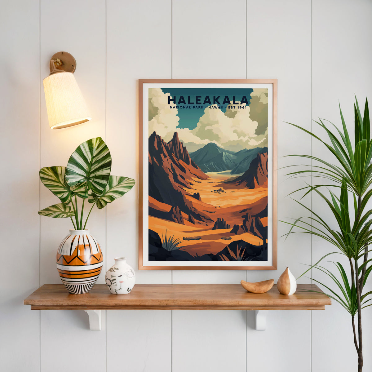 Haleakalā National Park print in a copper frame above an oak shelf on white shiplap