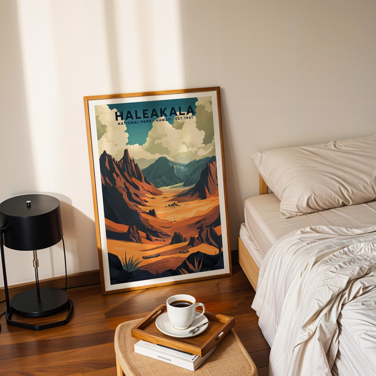 Haleakalā National Park print in an oak frame leaning on a bedroom floor beside the bed