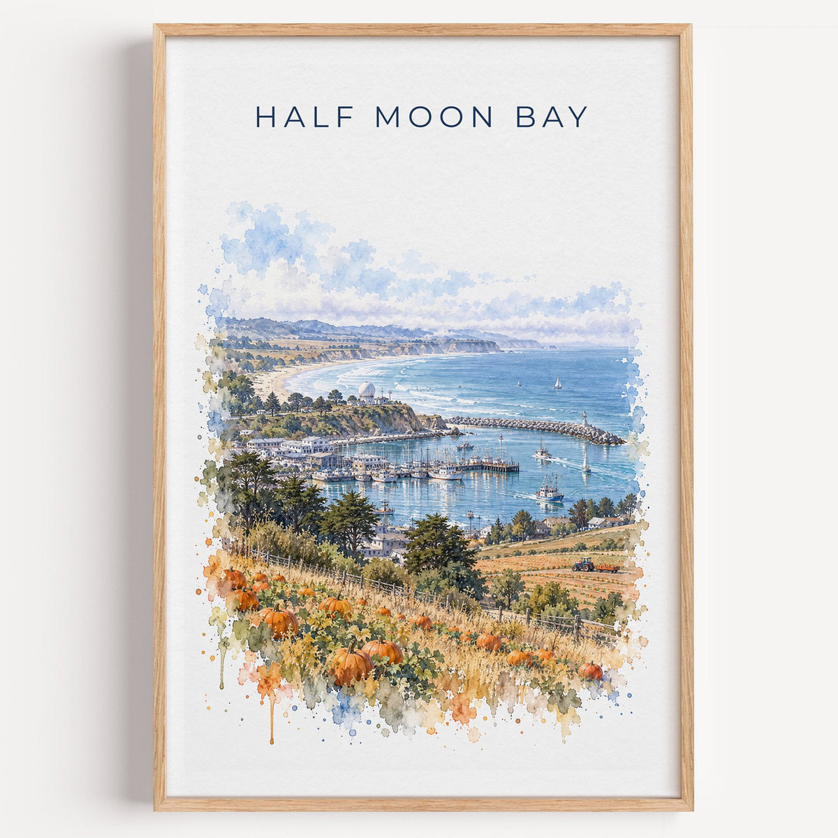 Half Moon Bay, California watercolor print in a light oak frame on a plain white wall