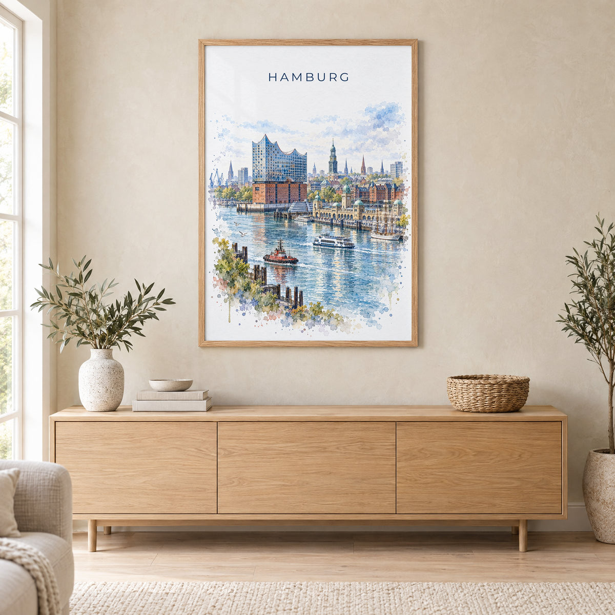 Hamburg watercolor print in an oak frame above a light wood sideboard in a Scandinavian living room