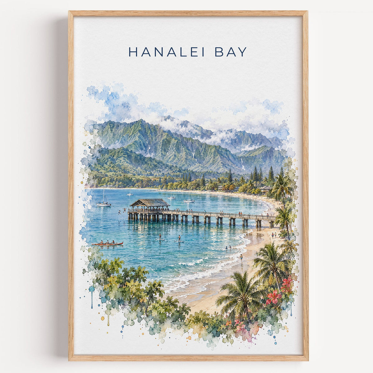 Hanalei Bay watercolor print in a light oak frame on a plain white wall