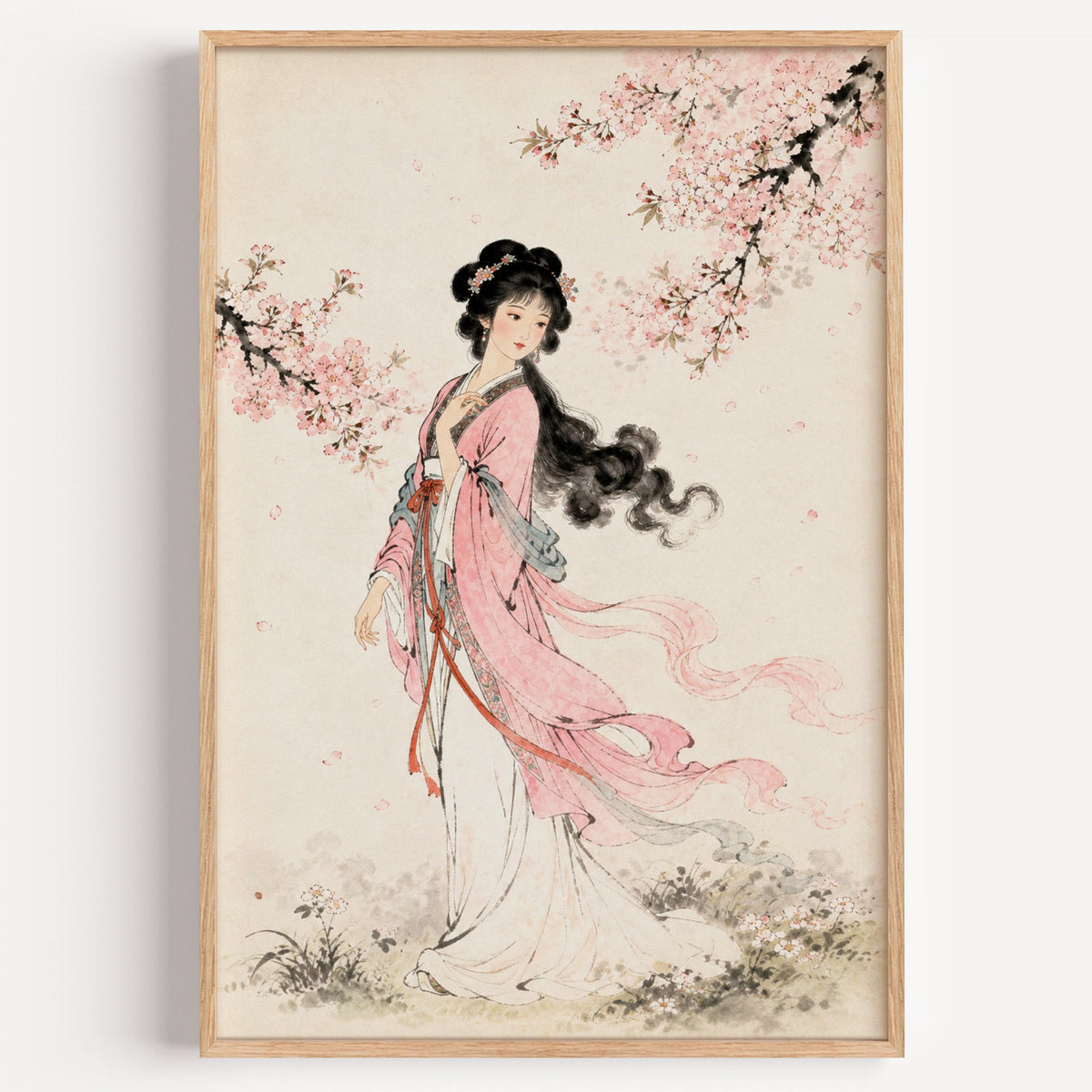 woman in pink hanfu under blossom print in a light oak frame on a plain white wall