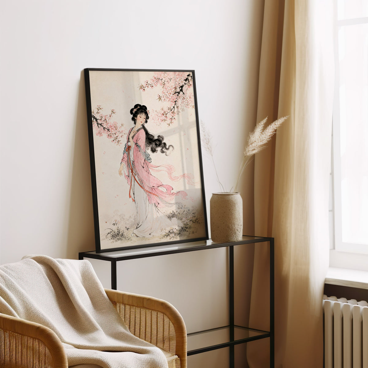 woman in pink hanfu under blossom print in a black frame leaning on a glass console beside pampas grass