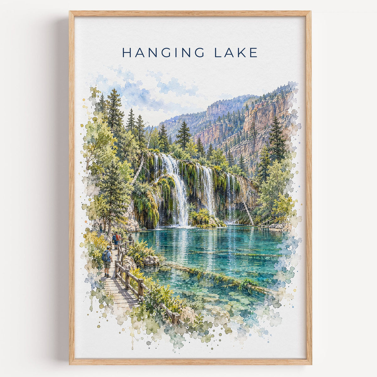 Hanging Lake watercolor print in a light oak frame on a plain white wall