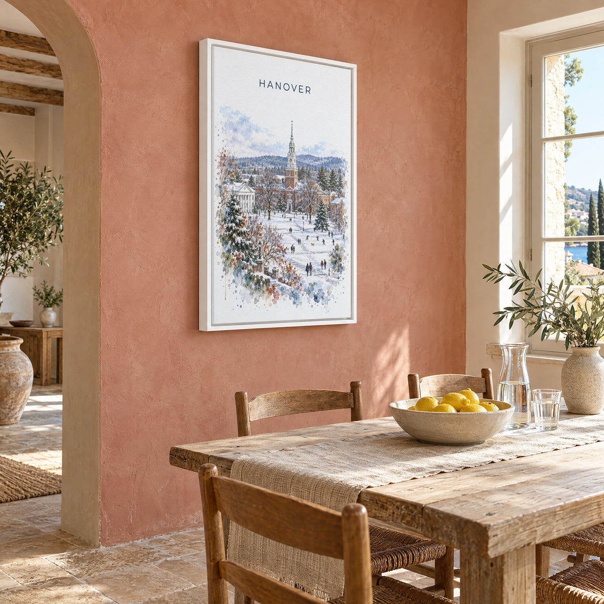 Hanover, New Hampshire watercolor print as a white floater canvas on a terracotta wall above a rustic dining table