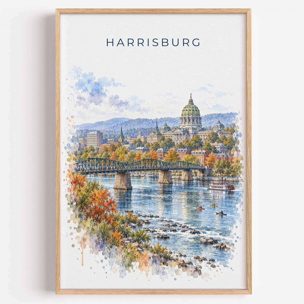 Harrisburg watercolor print in a light oak frame on a plain white wall