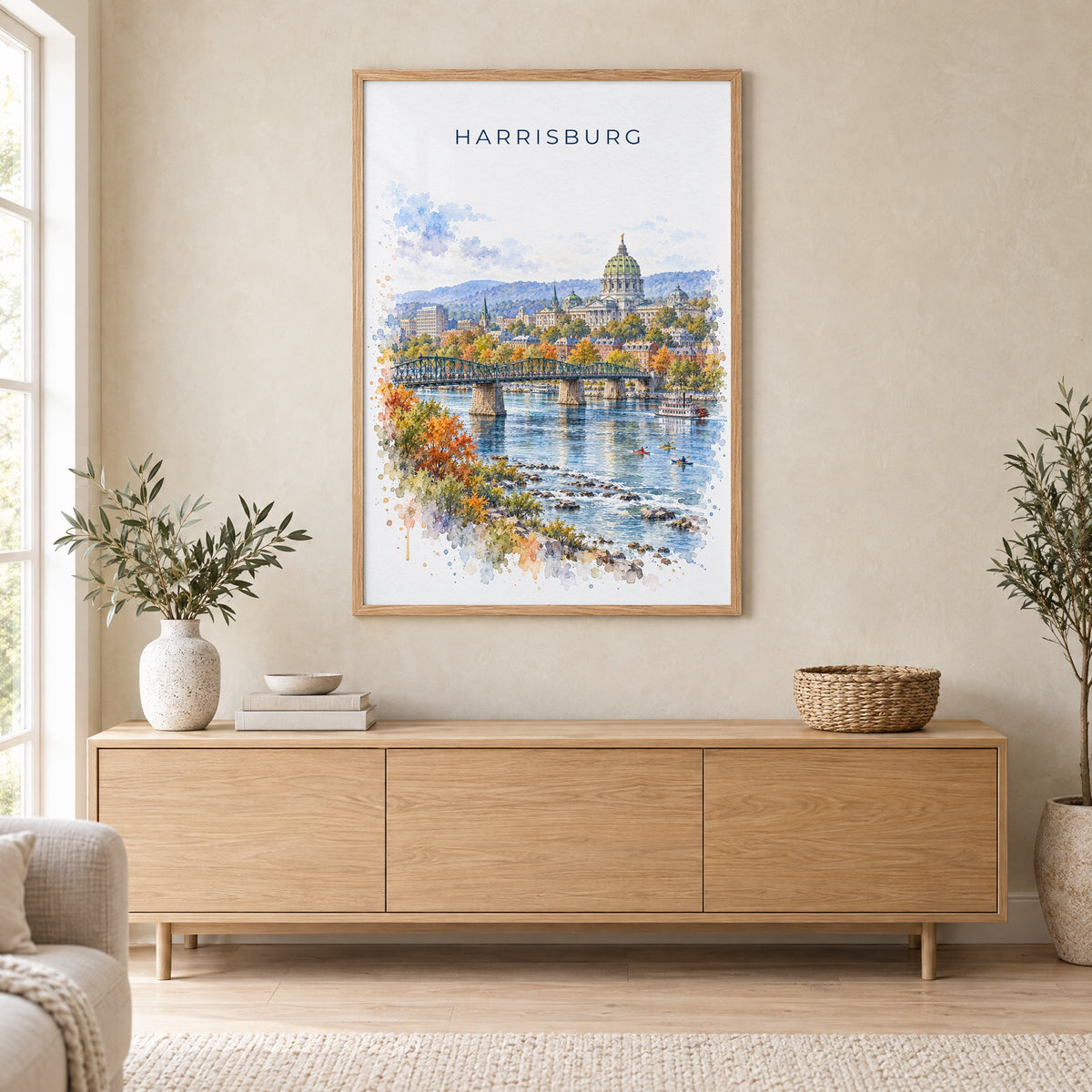 Harrisburg watercolor print in an oak frame above a light wood sideboard in a Scandinavian living room