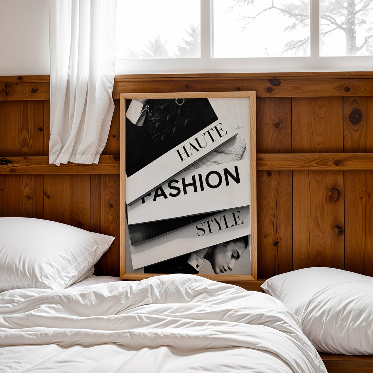 Stacked HAUTE FASHION STYLE books flat lay print in a pine frame leaning on a wood headboard over white bedding