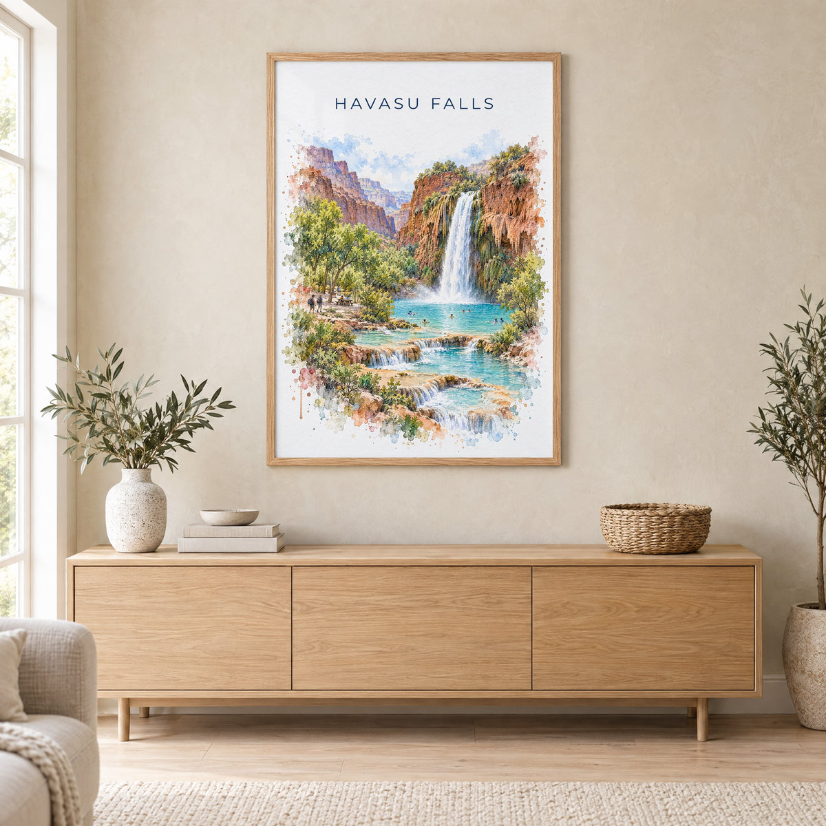 Havasu Falls watercolor print in an oak frame above a light wood sideboard in a Scandinavian living room