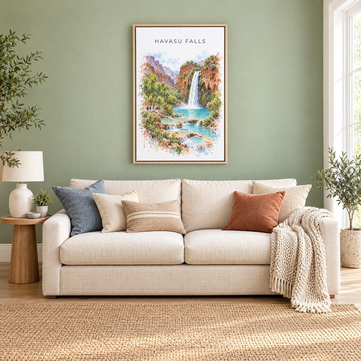 Havasu Falls watercolor print as a natural floater canvas above a cream linen sofa on a sage green wall
