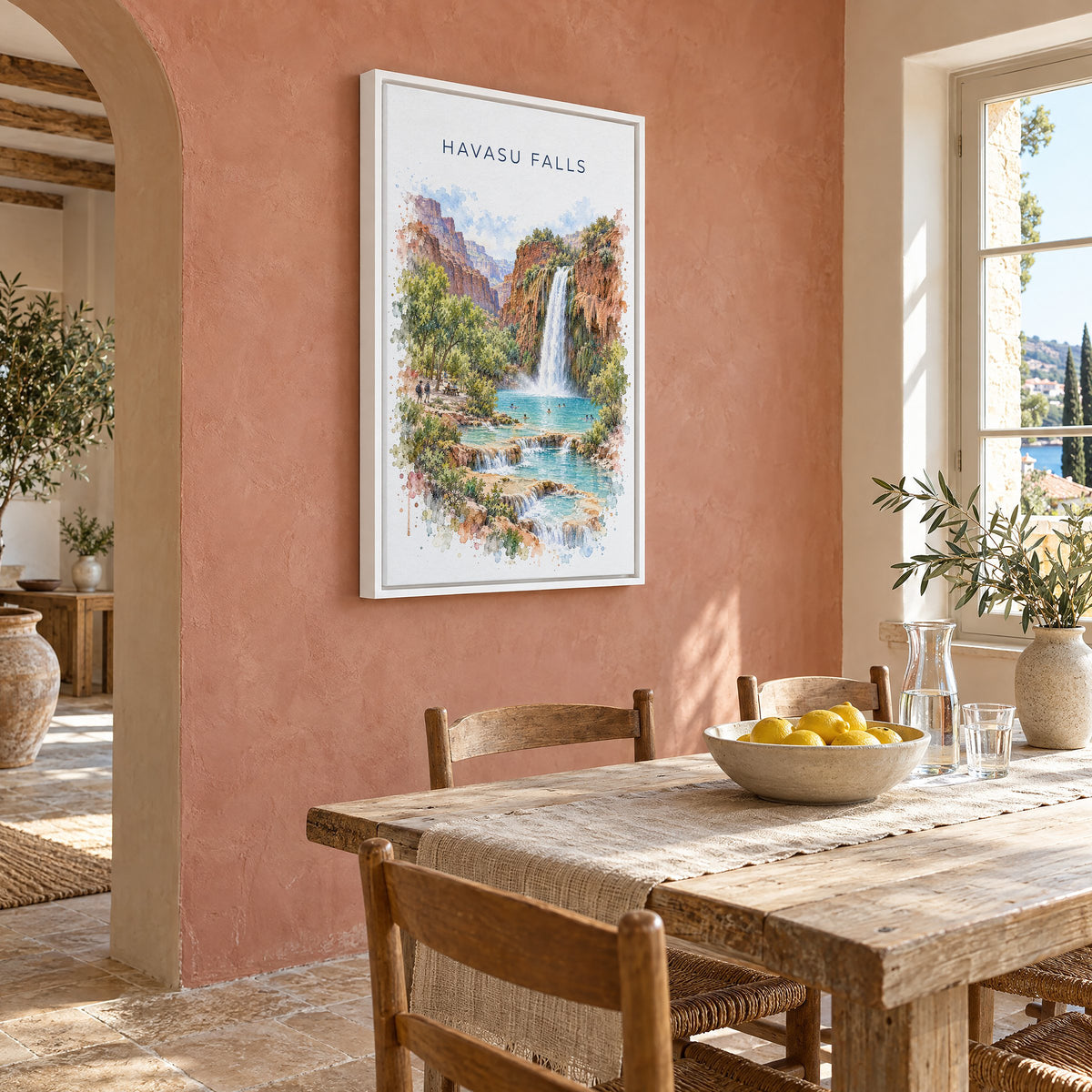 Havasu Falls watercolor print as a white floater canvas on a terracotta wall above a rustic dining table