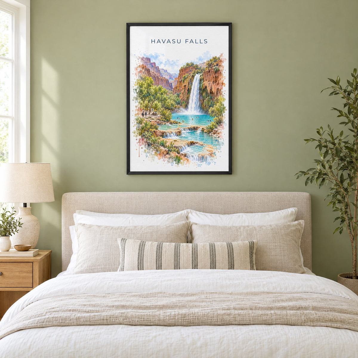 Havasu Falls watercolor print in a black frame above an upholstered headboard in a sage green bedroom