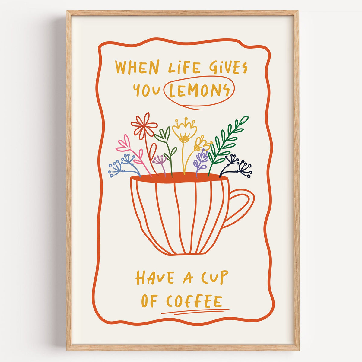 Have a cup of coffee print in a light oak frame on a plain white wall
