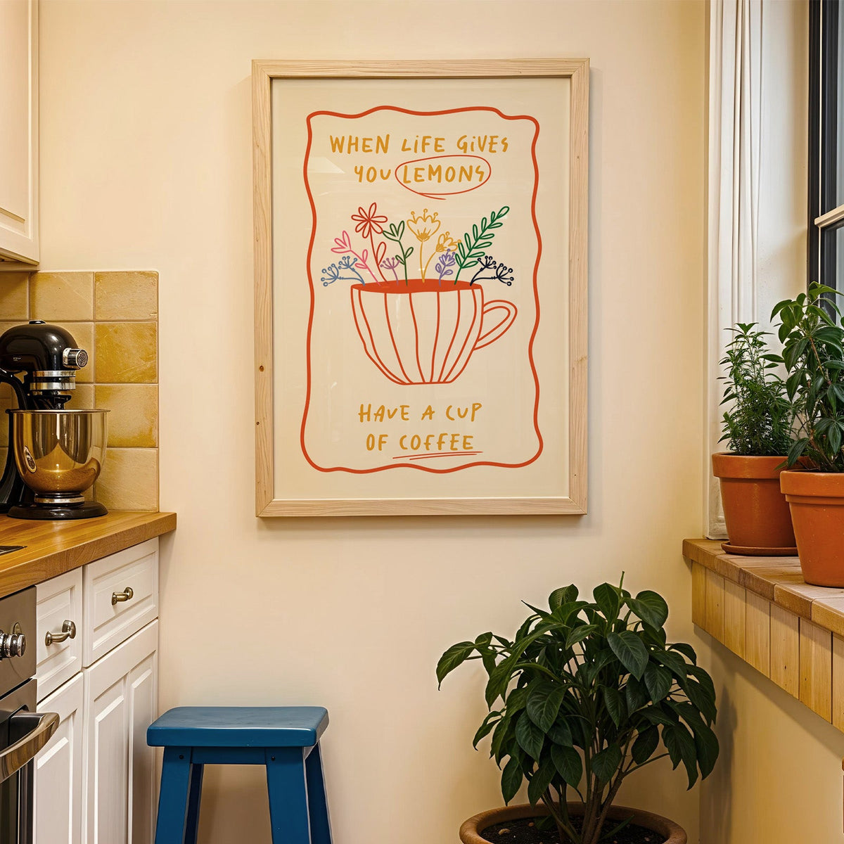 Have a cup of coffee print in a wood frame on a yellow tiled kitchen wall