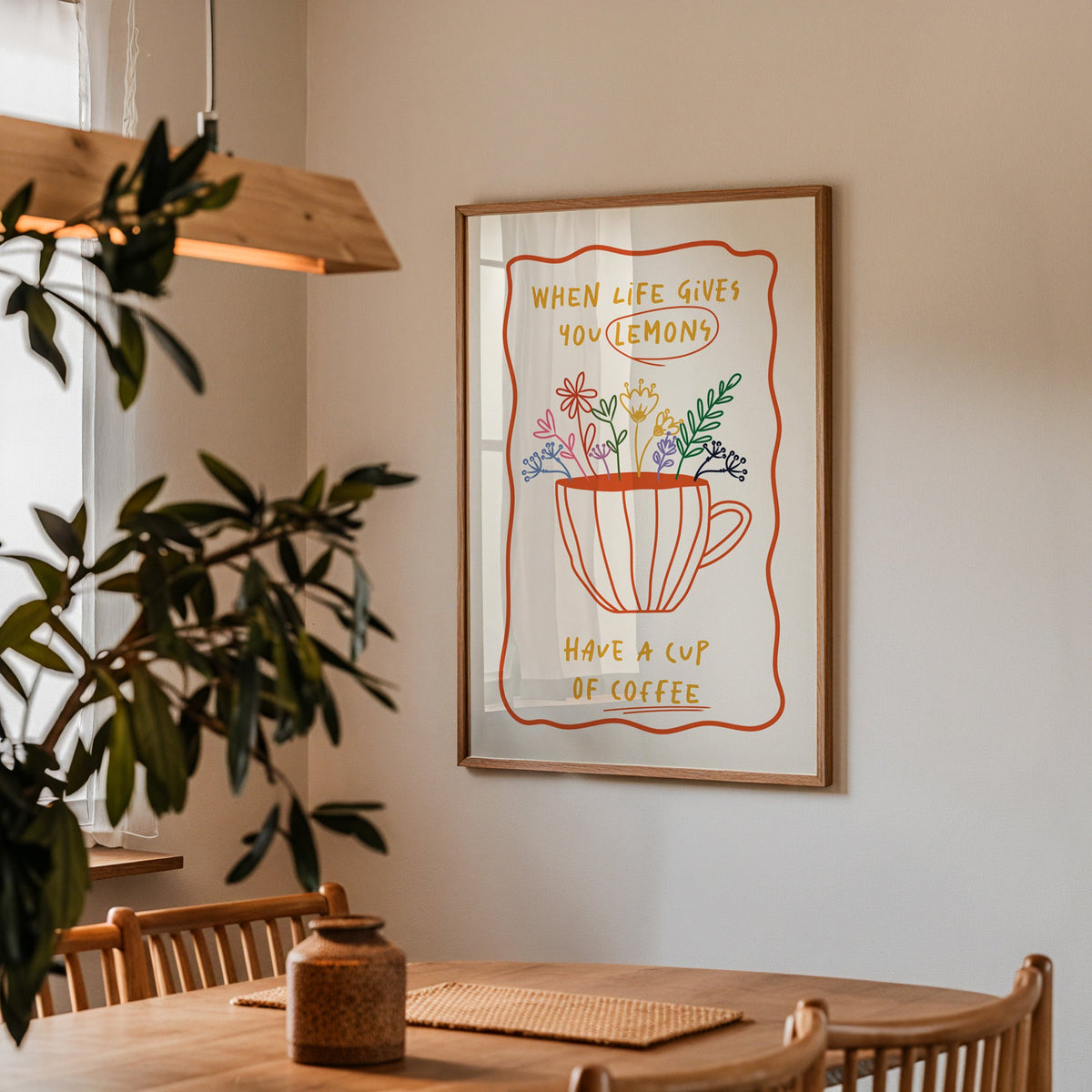 Have a cup of coffee print in a walnut frame above a dining table beside an olive tree