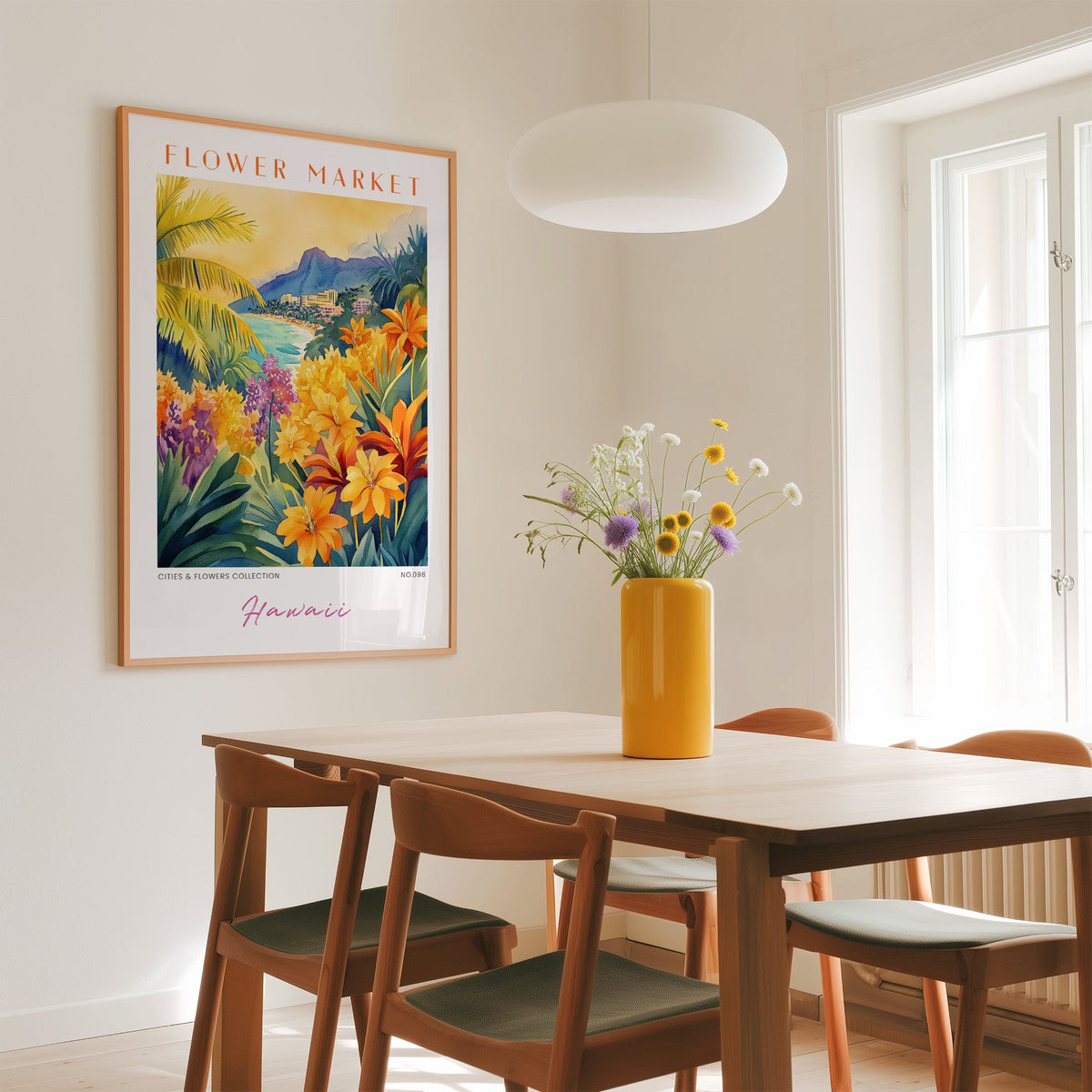 Hawaii flower market print in an oak frame above a dining table with a yellow vase and white pendant light