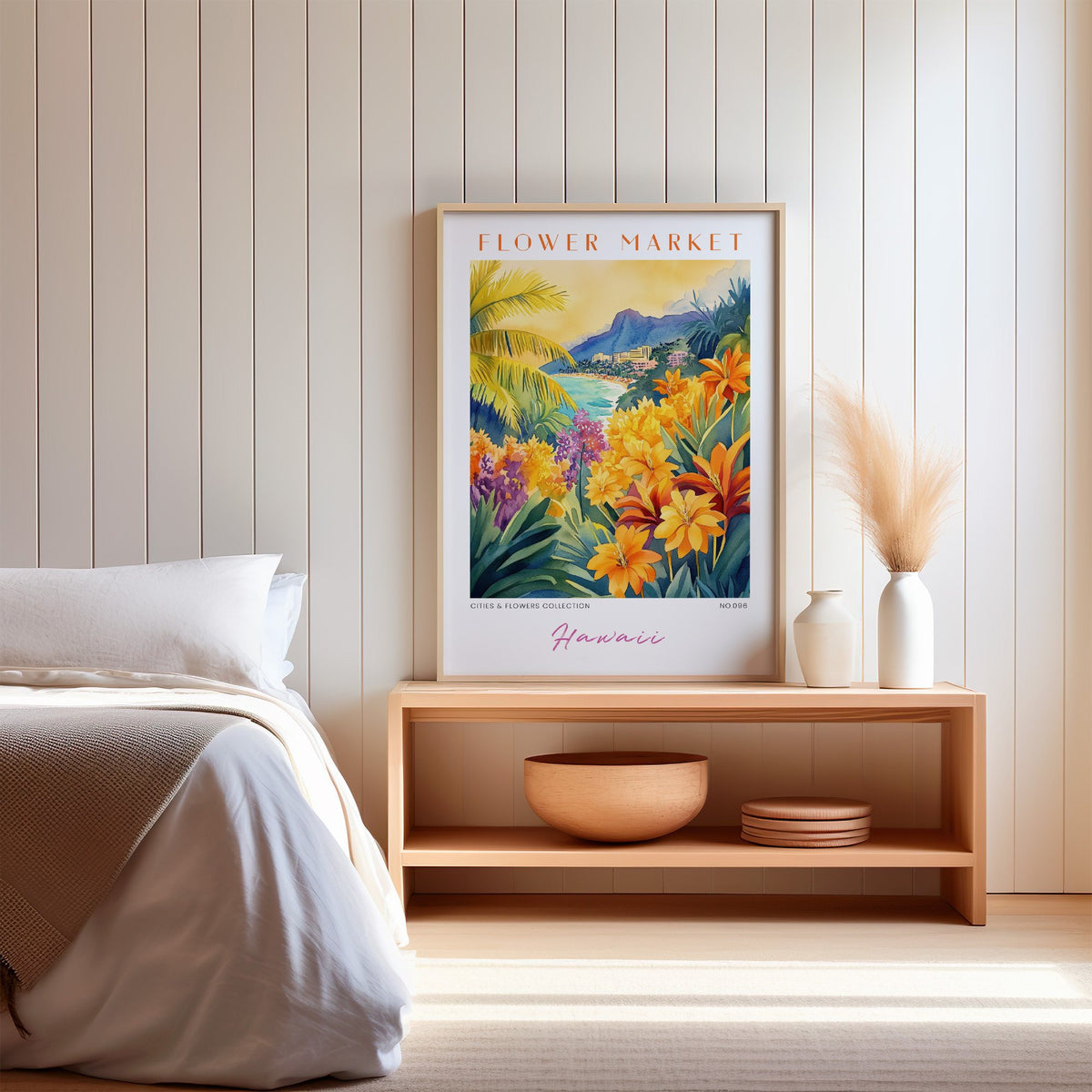 Hawaii flower market print in an oak frame on a wood bench against a white shiplap bedroom wall with pampas grass