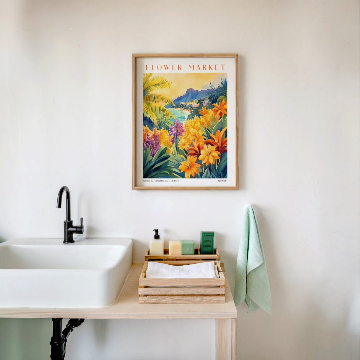 Hawaii flower market print in an oak frame above a white bathroom sink with folded towels