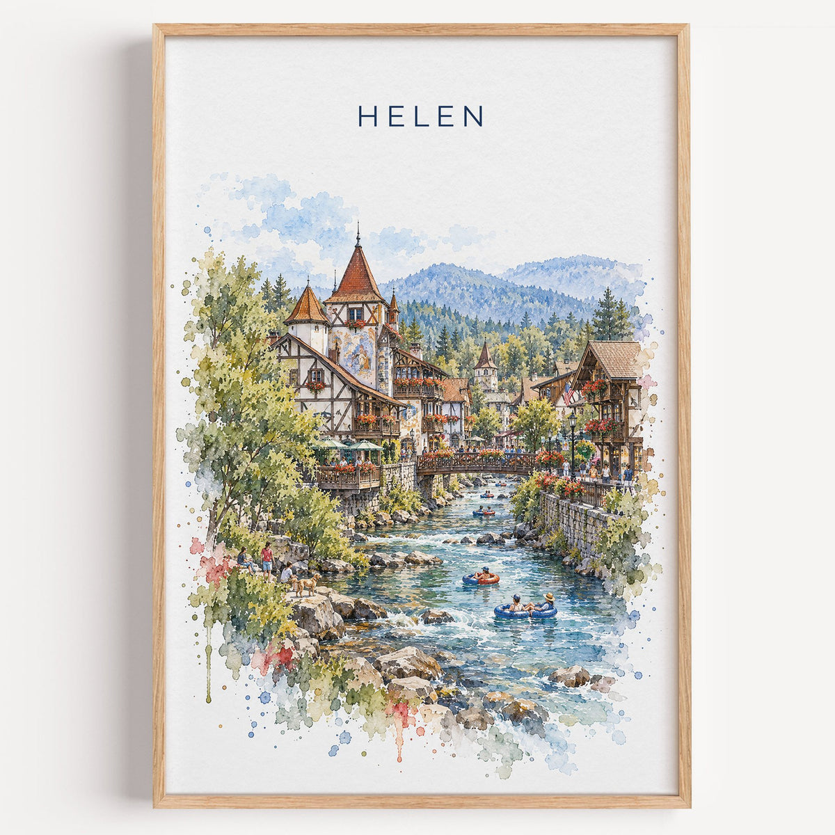 Helen, Georgia watercolor print in a light oak frame on a plain white wall