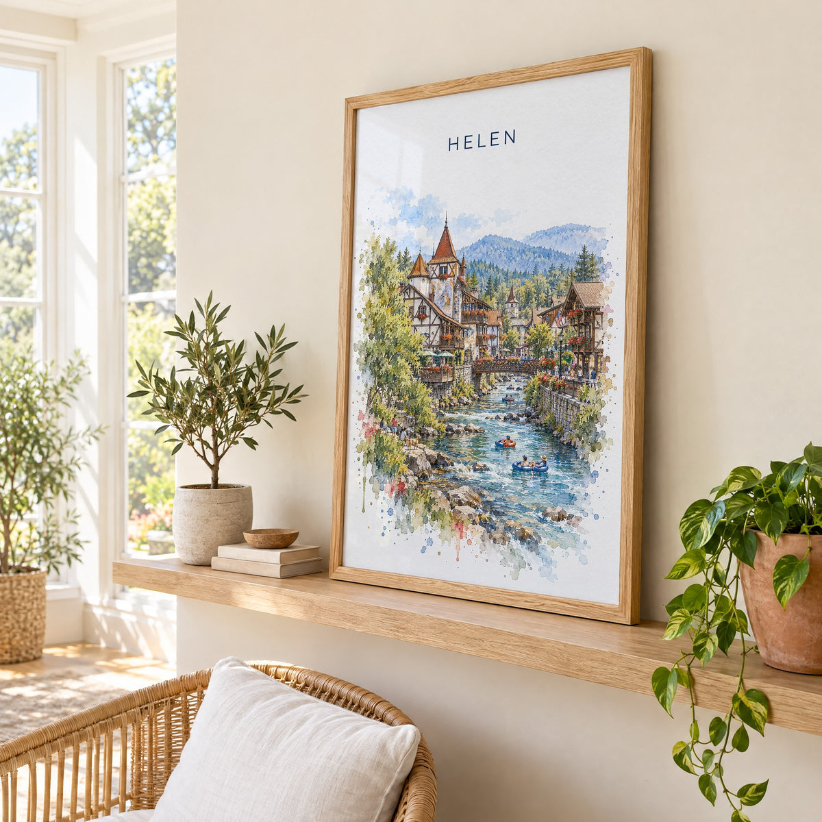 Helen, Georgia watercolor print in an oak frame on a picture ledge in a sunlit sunroom