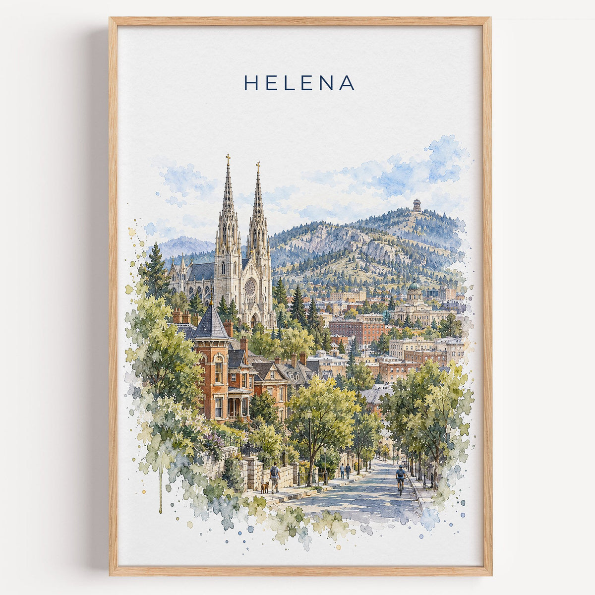 Helena, Montana watercolor print in a light oak frame on a plain white wall