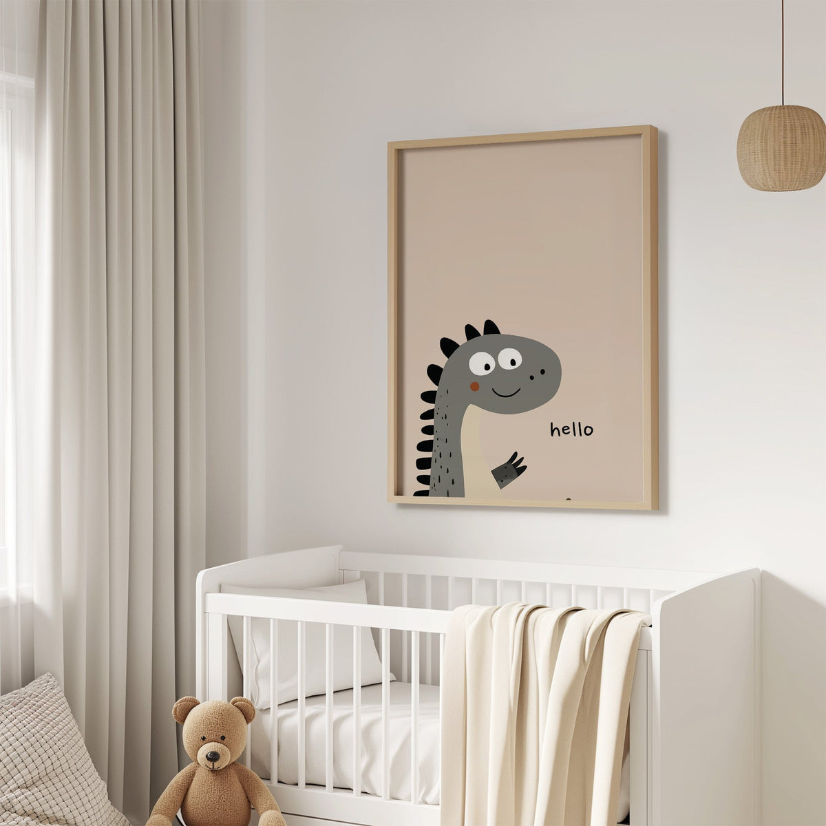 Hello peeking dinosaur nursery print in an oak frame above a white crib with a teddy bear