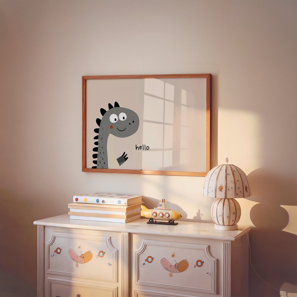 Landscape hello peeking dinosaur nursery print in a cherry wood frame above a painted dresser and lamp