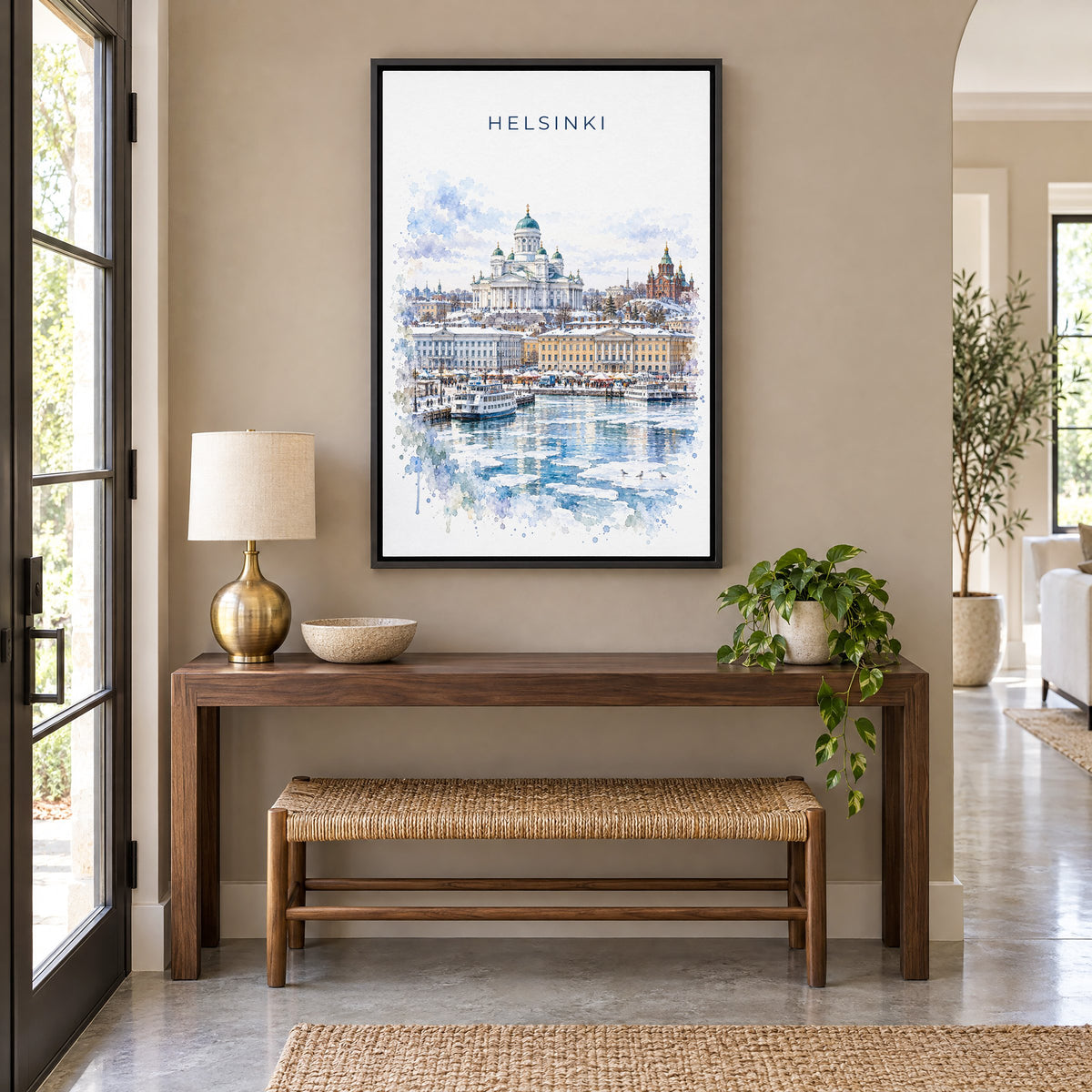 Helsinki watercolor print as a black floater canvas above a walnut console and woven bench in an entryway