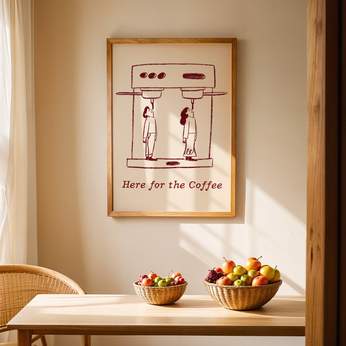 Here for the Coffee machine print in an oak frame above a light wood dining table with baskets of fruit