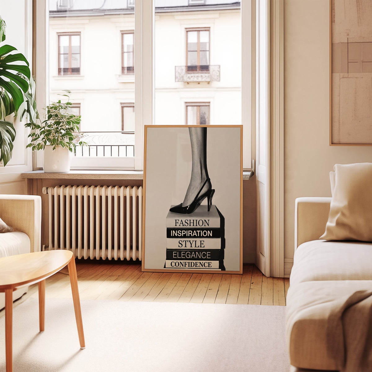 Black slingback heel on stack of word books print in an oak frame leaning by a French window in a living room