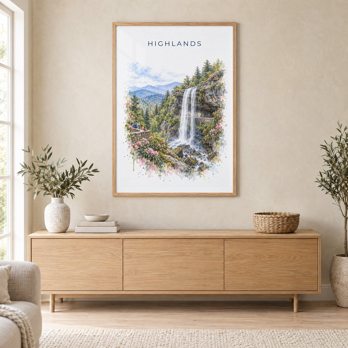 Highlands, North Carolina watercolor print in an oak frame above a light wood sideboard in a Scandinavian living room