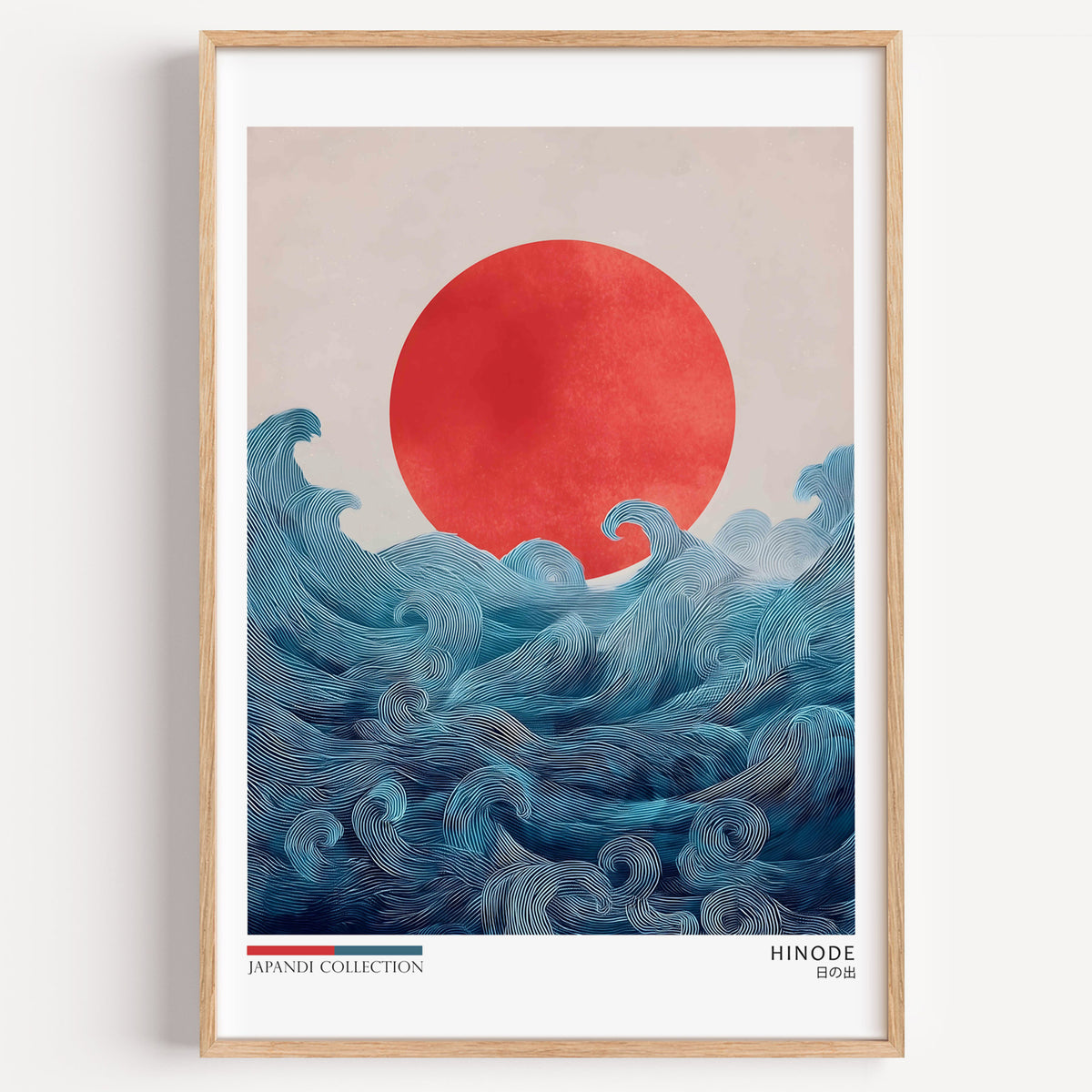 Hinode red sun over waves print in a light oak frame on a plain white wall