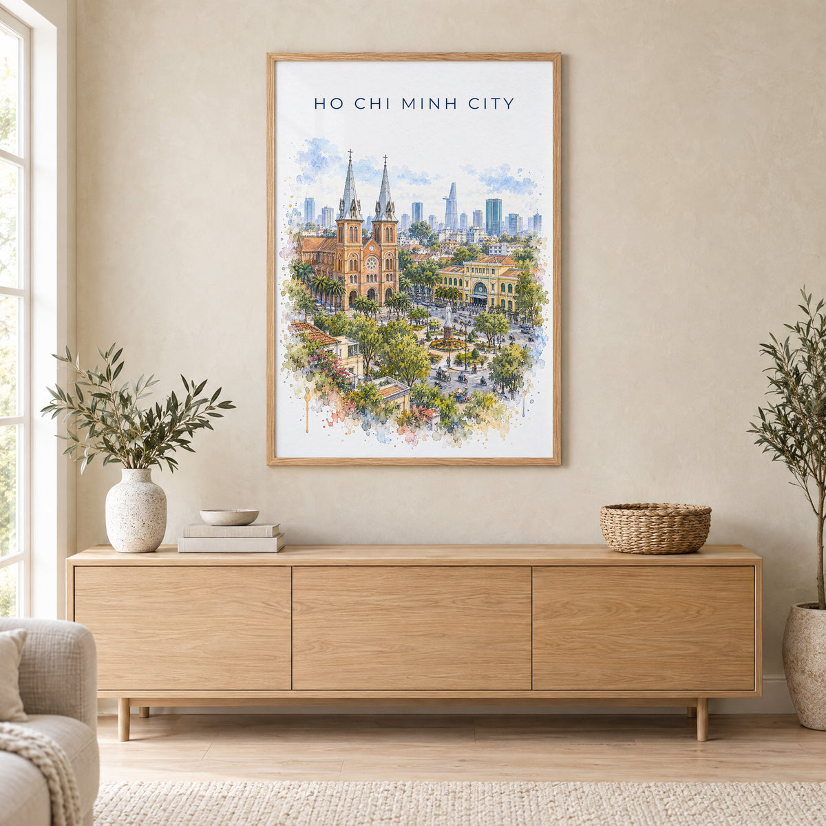 Ho Chi Minh City watercolor print in an oak frame above a light wood sideboard in a Scandinavian living room