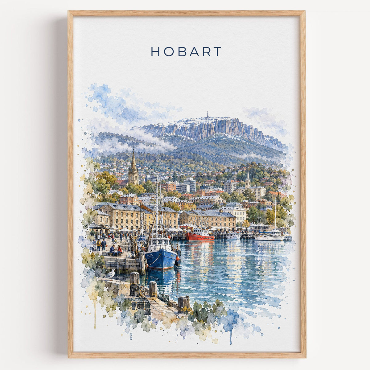 Hobart watercolor print in a light oak frame on a plain white wall