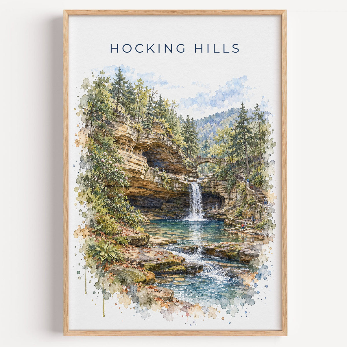 Hocking Hills watercolor print in a light oak frame on a plain white wall
