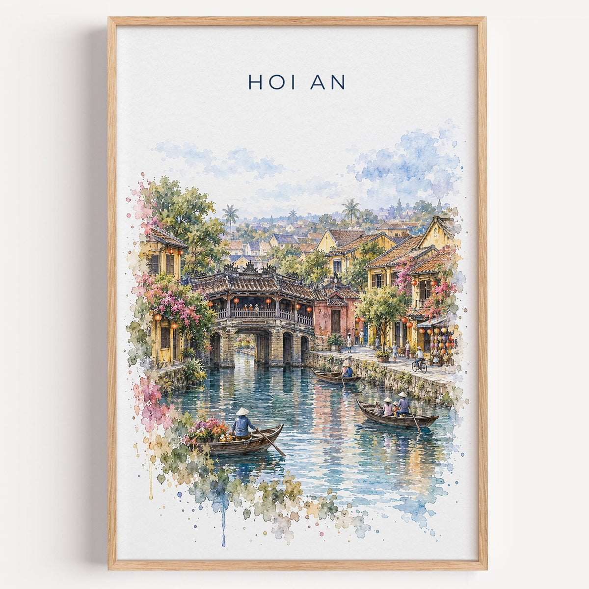 Hoi An watercolor print in a light oak frame on a plain white wall