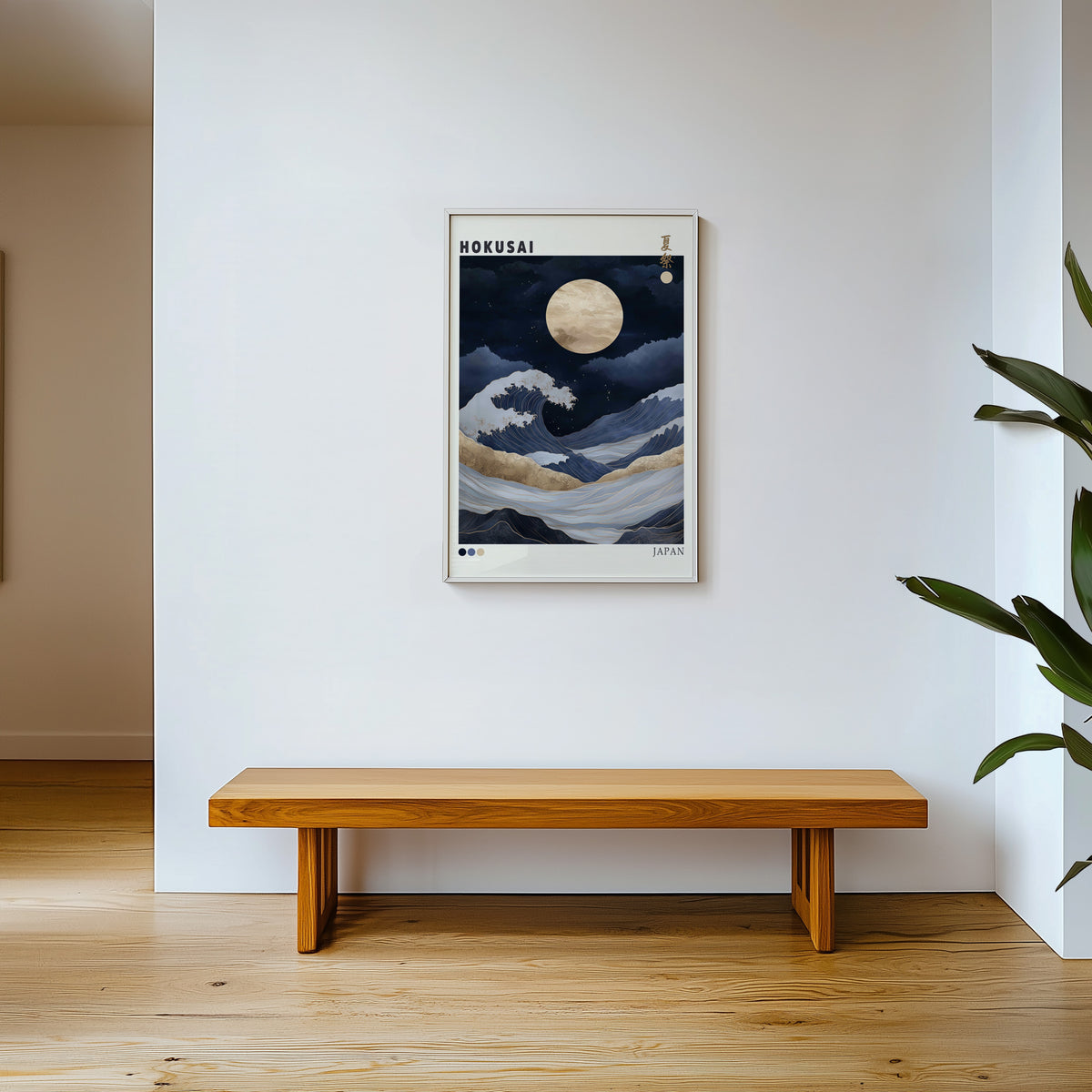 Hokusai night wave gold moon print shown in a white frame above a wooden entryway bench