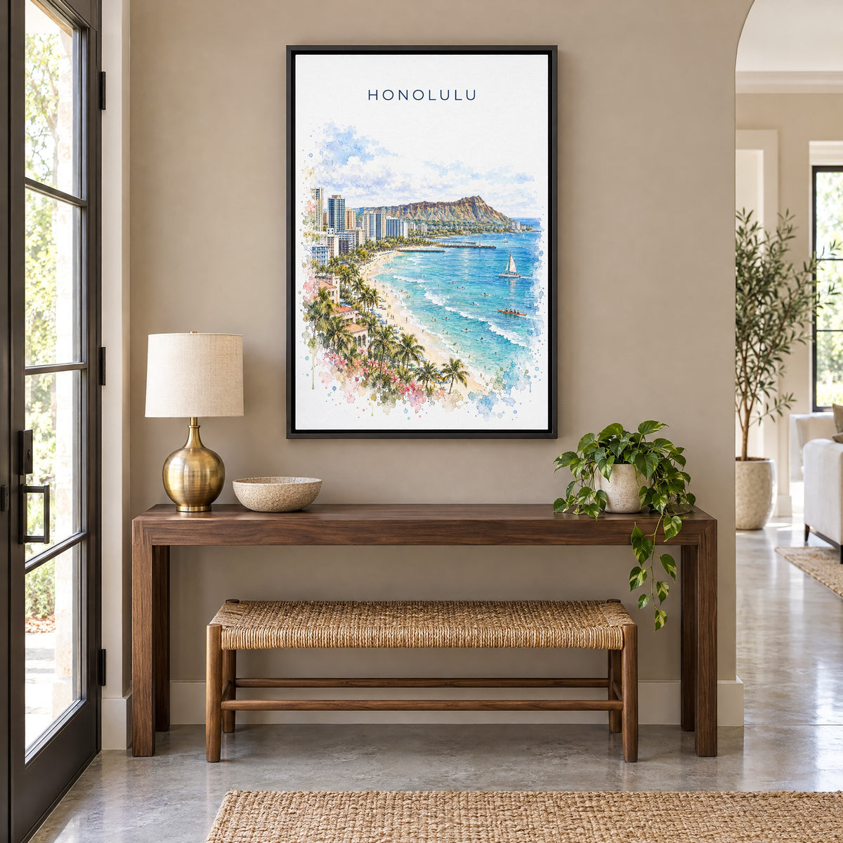 Honolulu watercolor print as a black floater canvas above a walnut console and woven bench in an entryway