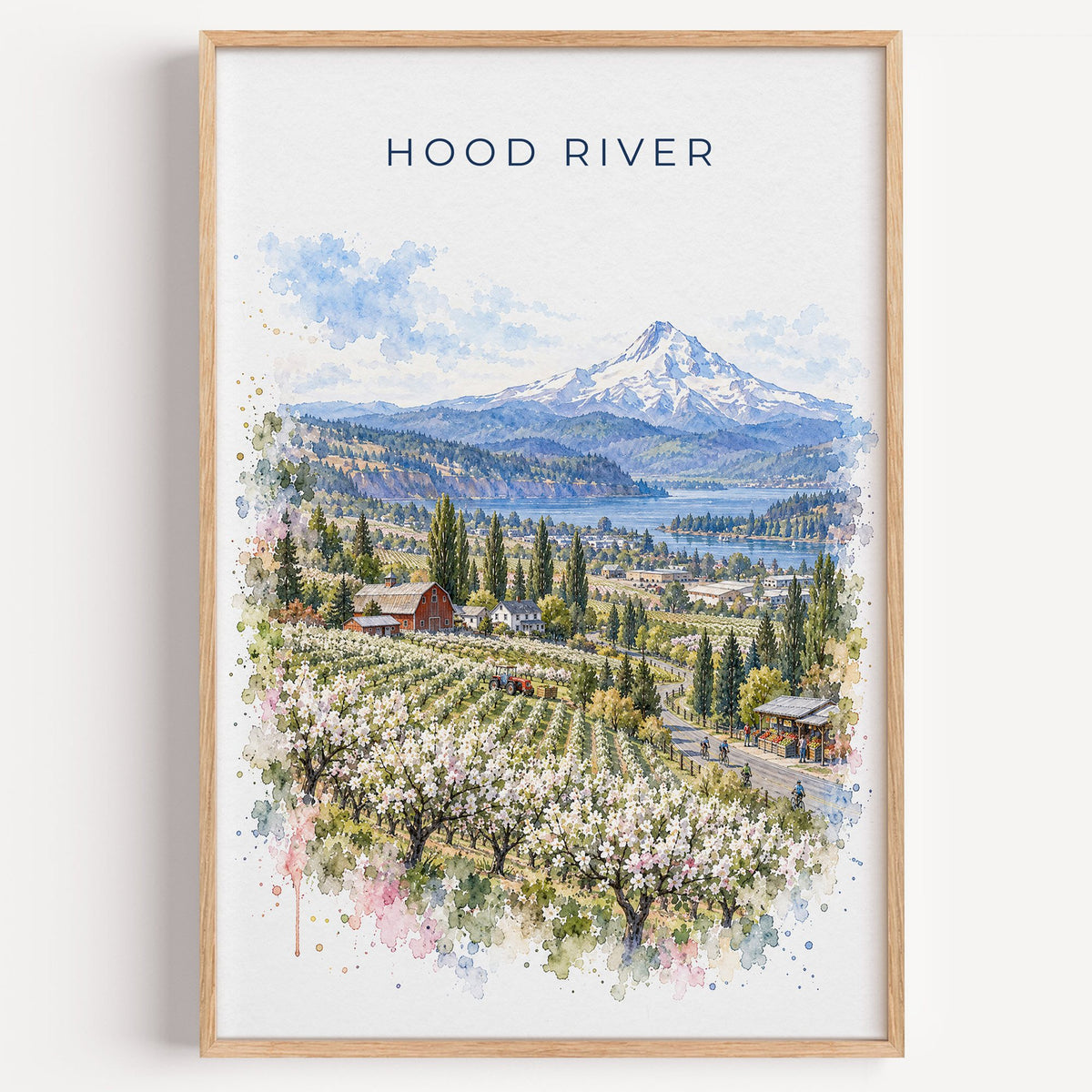Hood River watercolor print in a light oak frame on a plain white wall