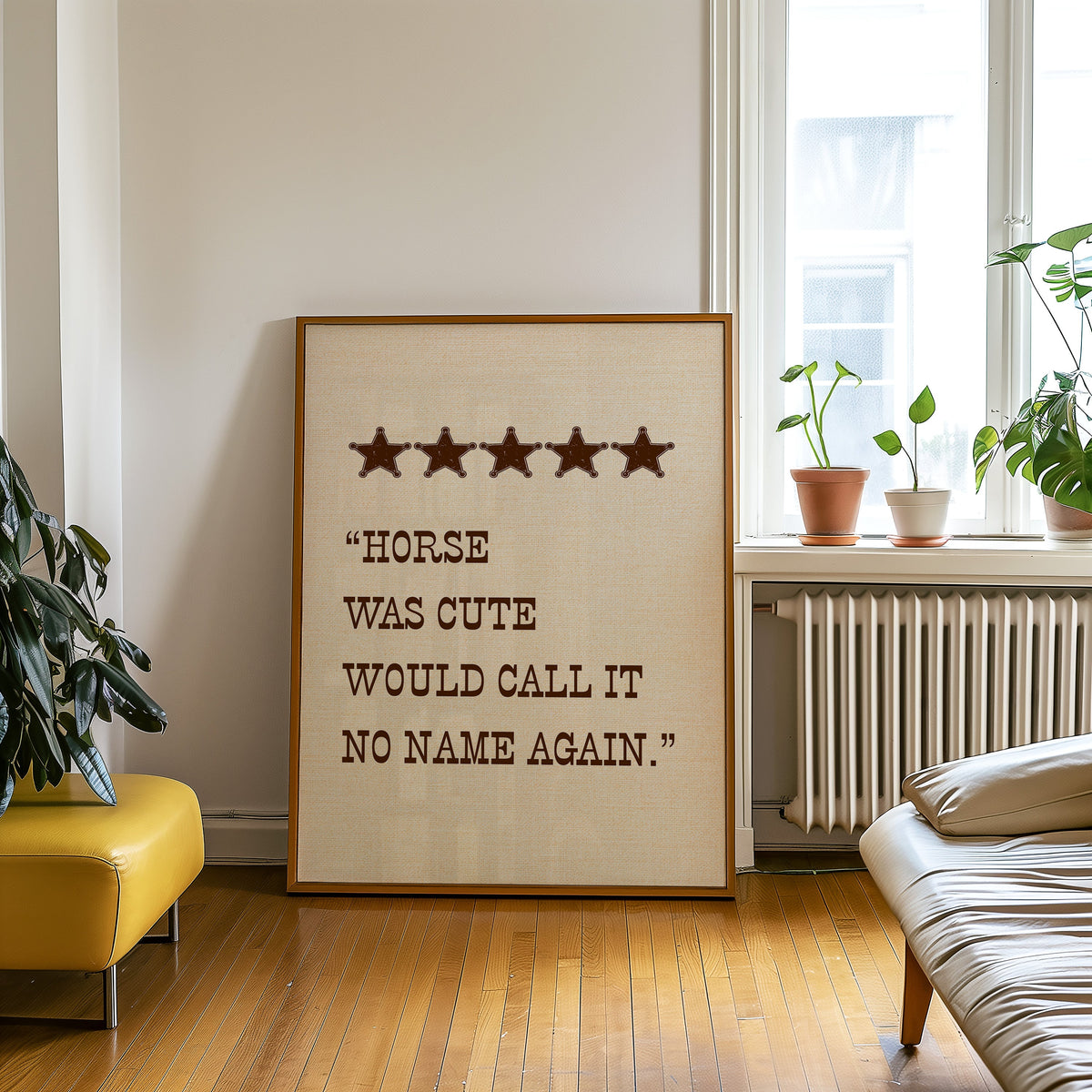 Horse Was Cute five star print in an oak frame on a parquet floor beside a yellow bench