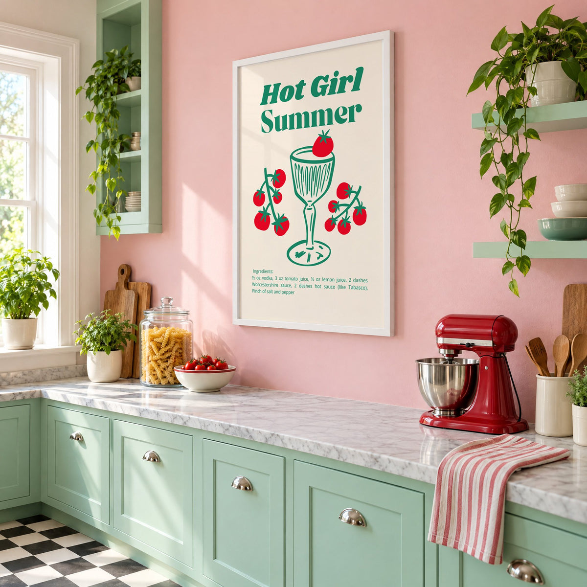 Hot Girl Summer tomato cocktail recipe print in a white frame on a pink wall above mint green cabinets in a retro kitchen, seen at an angle