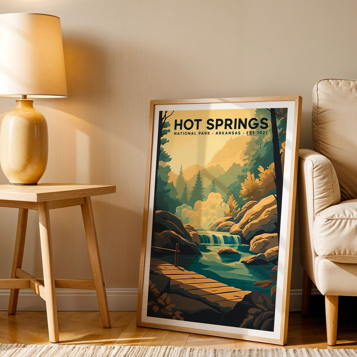 Hot Springs print in an oak frame beside a cream armchair and an amber lamp in warm afternoon light