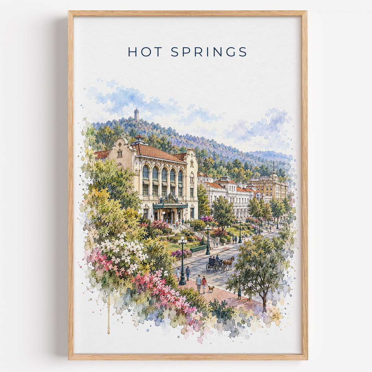 Hot Springs National Park watercolor print in a light oak frame on a plain white wall