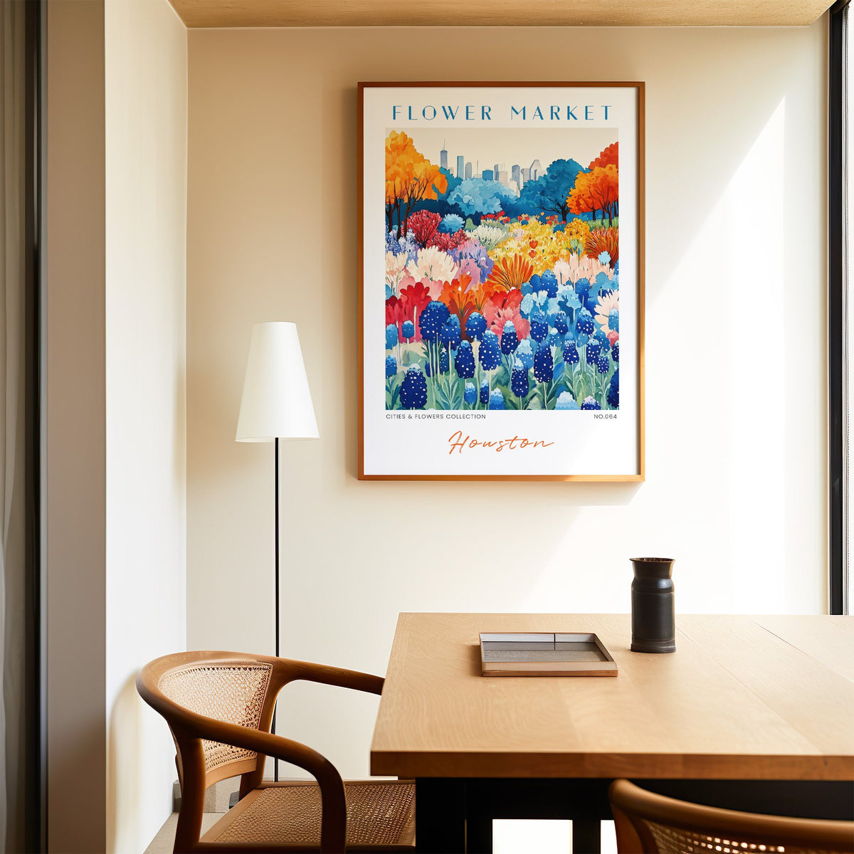 Houston flower market print in an oak frame above a dining table and cane chair